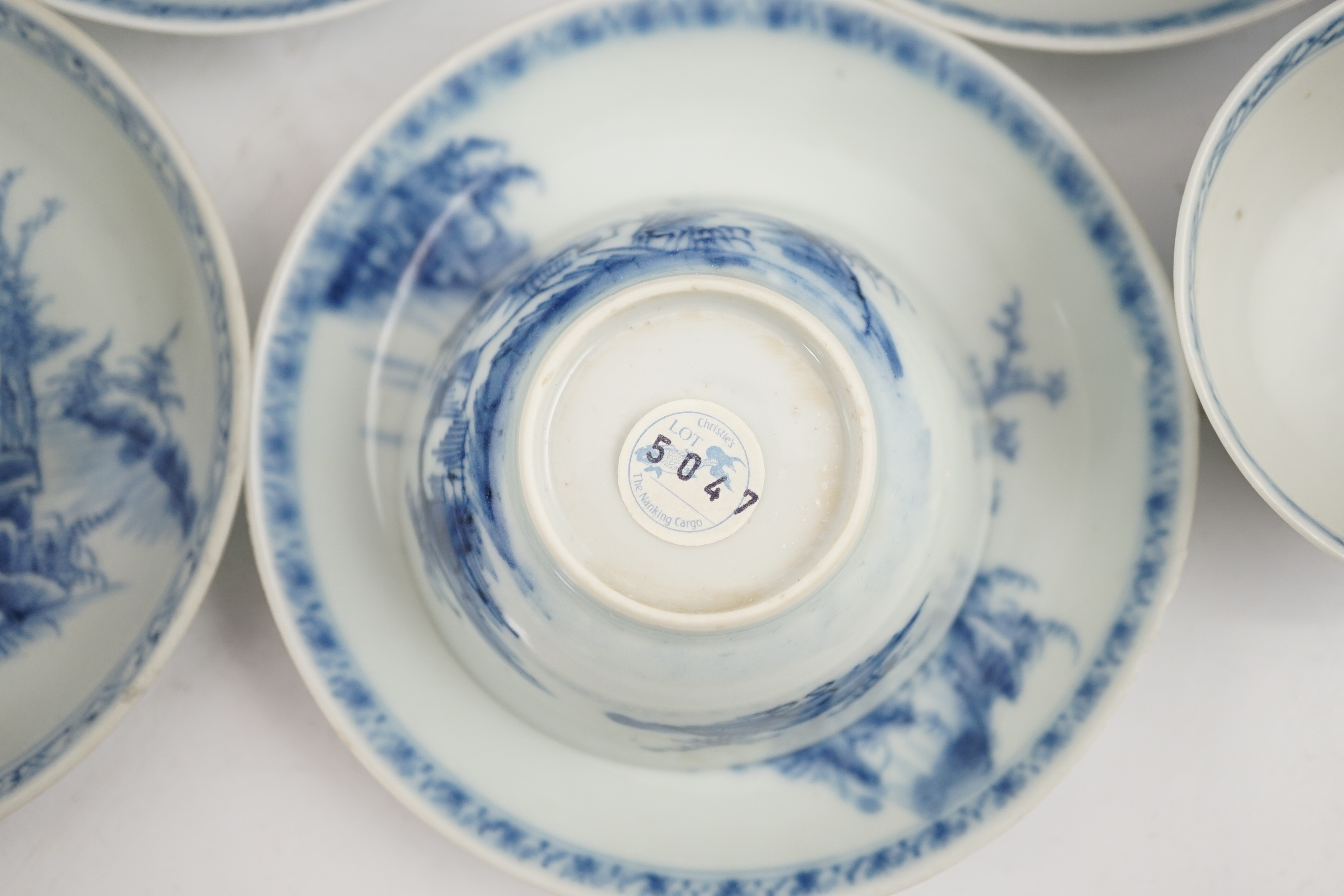 A set of twenty four Chinese Nanking Cargo blue and white ‘large pagoda’ tea bowls and saucers, Qianlong period